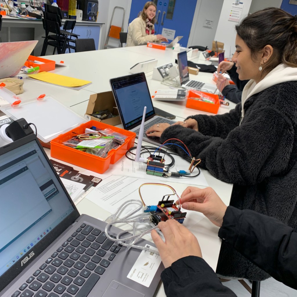 student working at a desk on a project